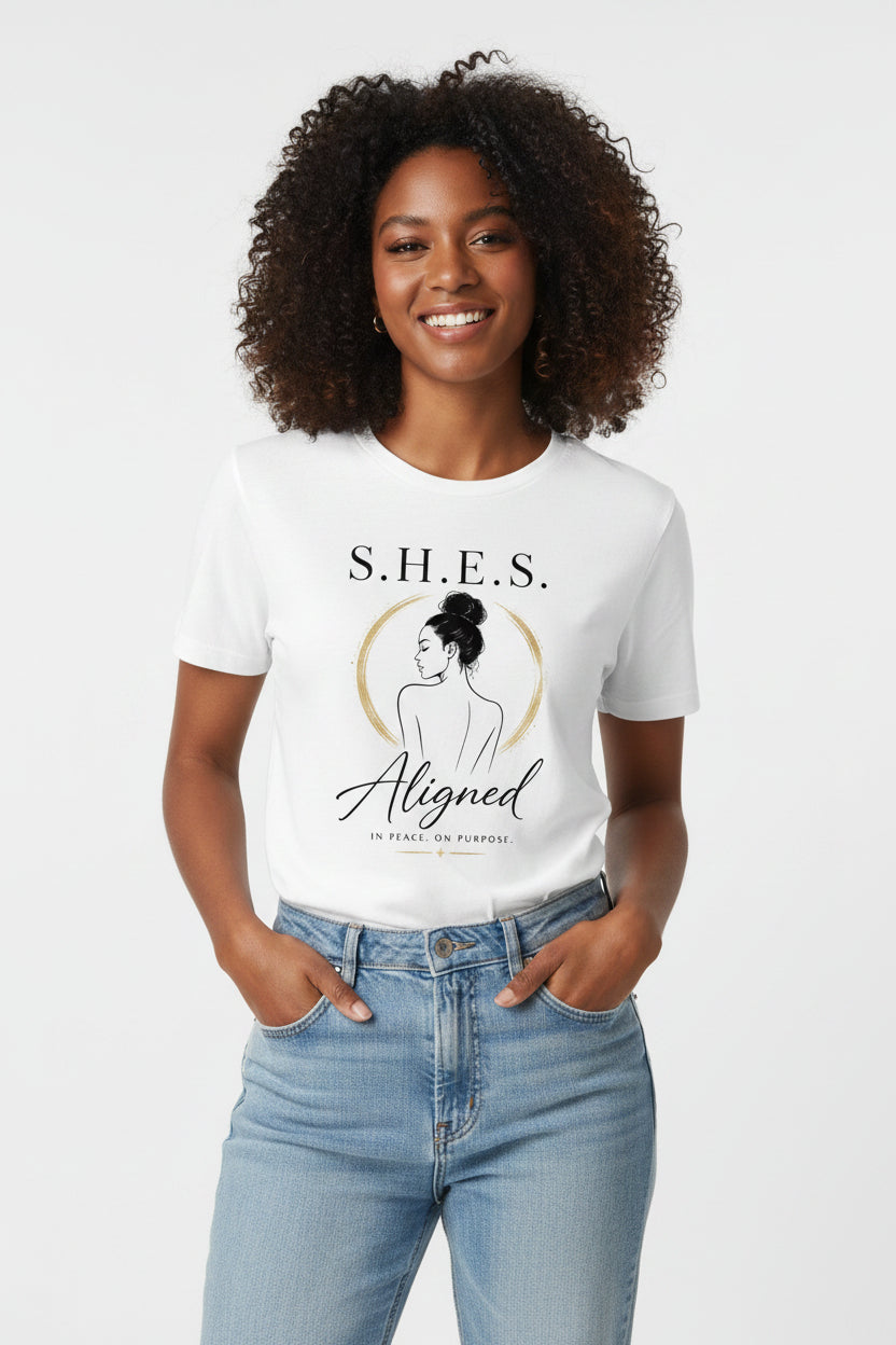 SHES & COMPANY BOUTIQUE white cotton graphic tee featuring a woman illustration and the text S.H.E.S. Aligned